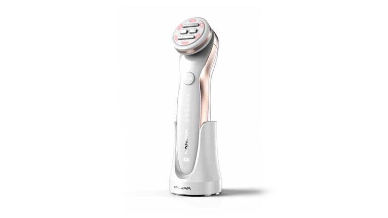 White and rose-gold RF beauty device with charging dock