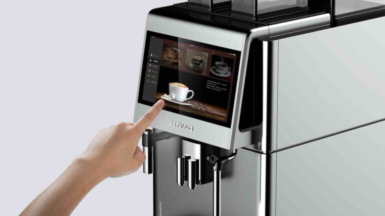coffee machine development — user interacting with the touchscreen on a dark background, highlighting the premium commercial interface