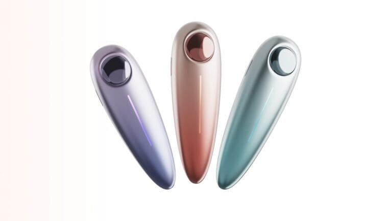 Massage comb development — three color variants of the smart electric massage comb in lavender, rose gold, and mint